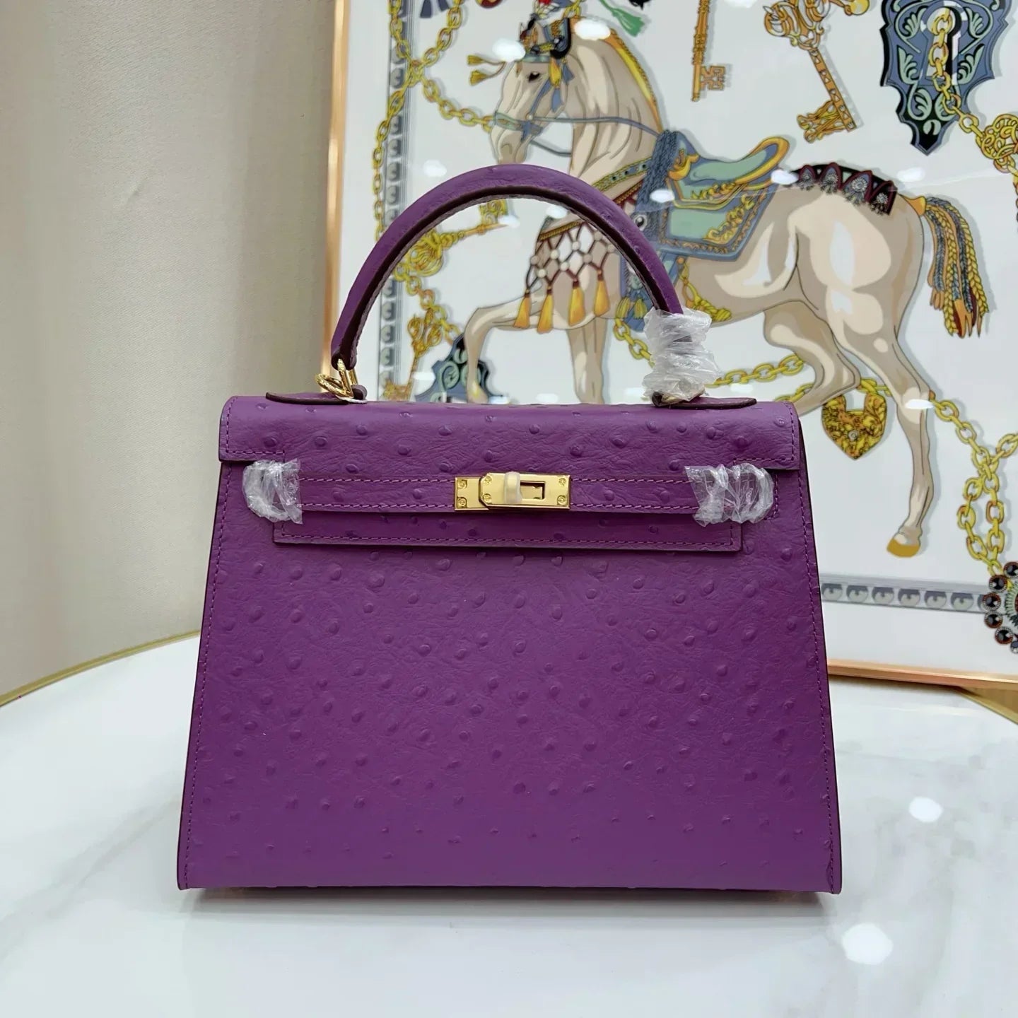 Kelly II Mini Purple-Red Ostrich Leather with Gold Hardware