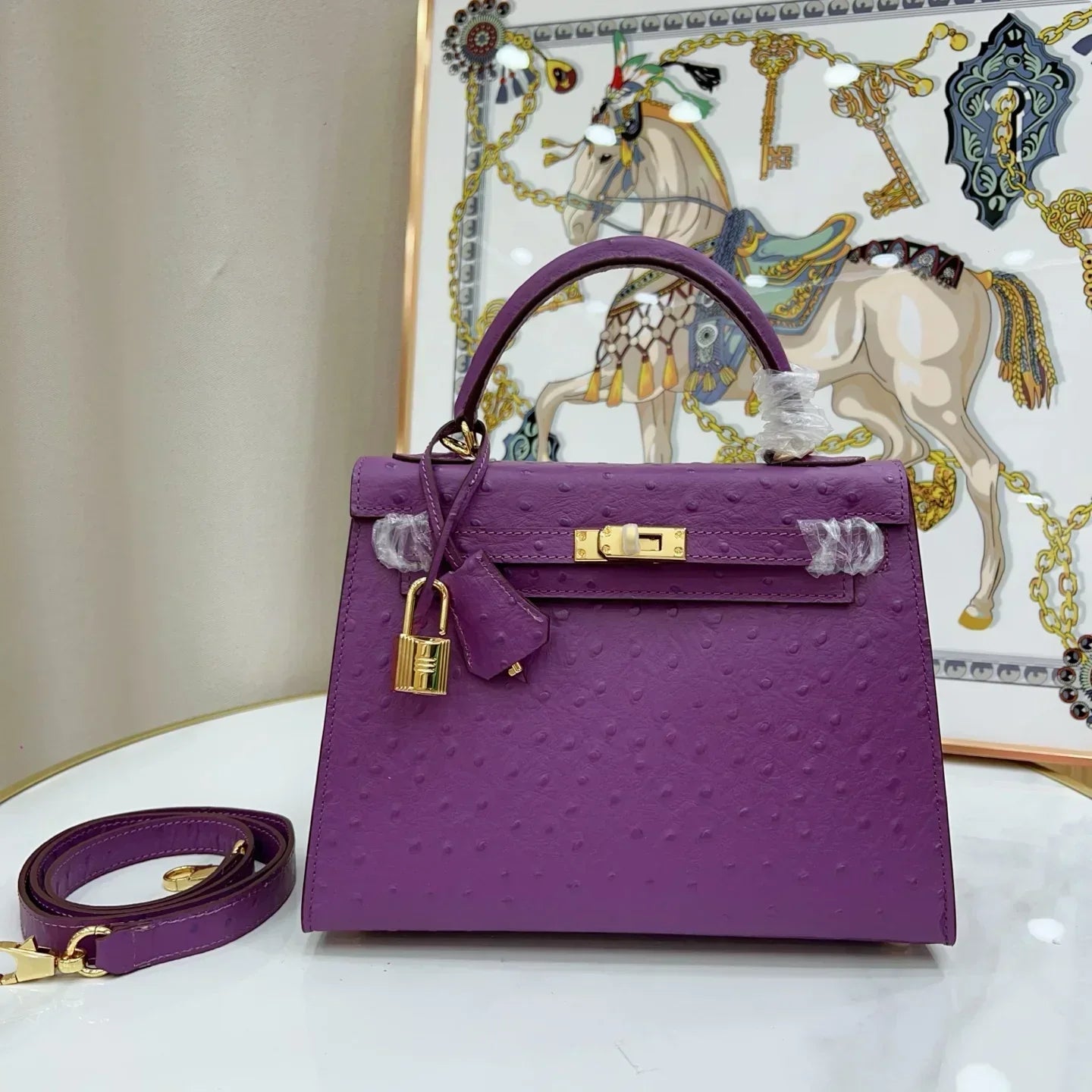 Kelly II Mini Purple-Red Ostrich Leather with Gold Hardware