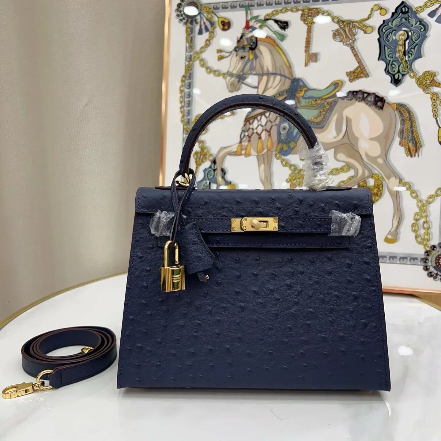 Kelly 25 Bleu Iris Sellier Ostrich Gold Hardware